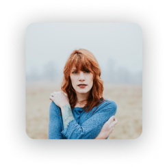 Example profile picture of a red-haired woman in a blue top