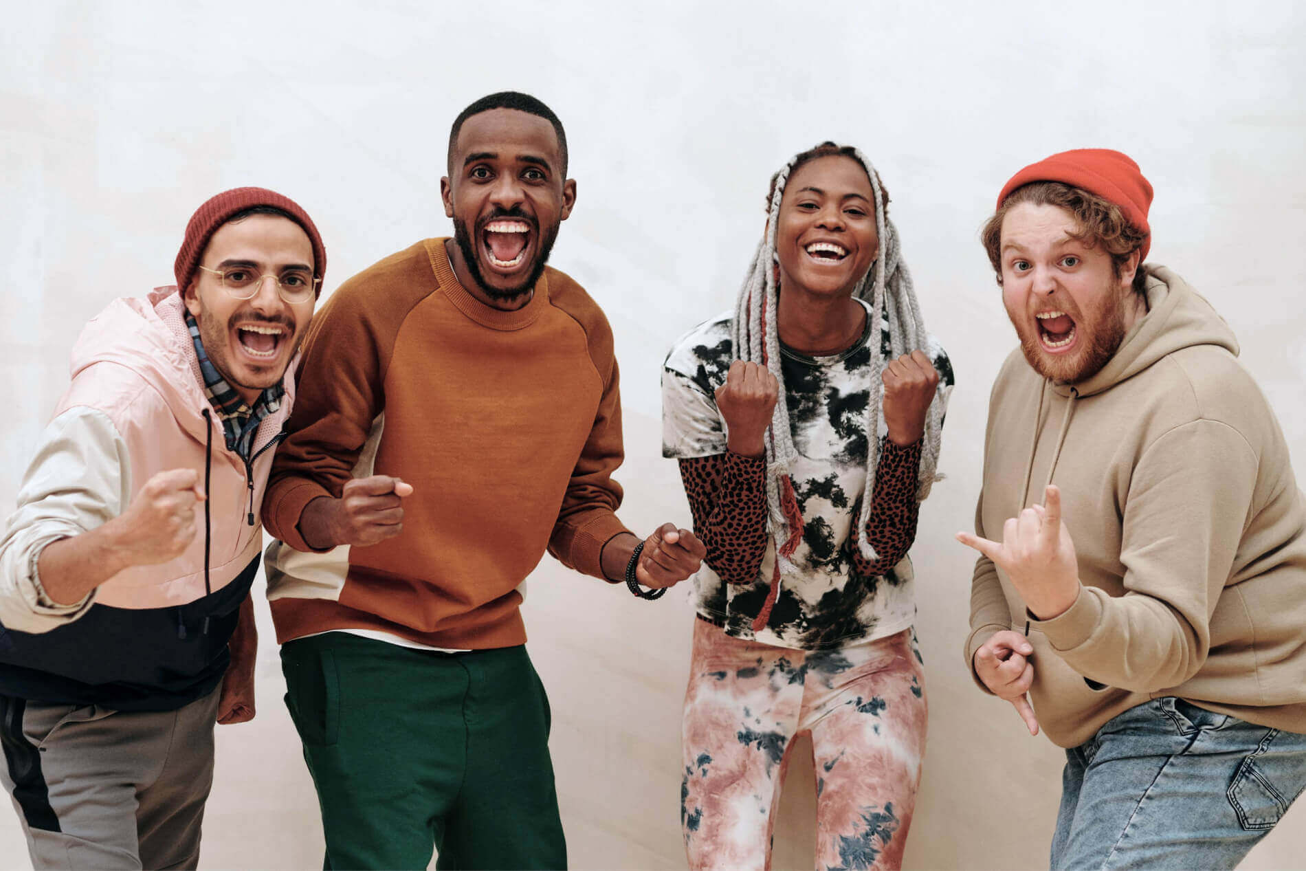A group of four smiling people.